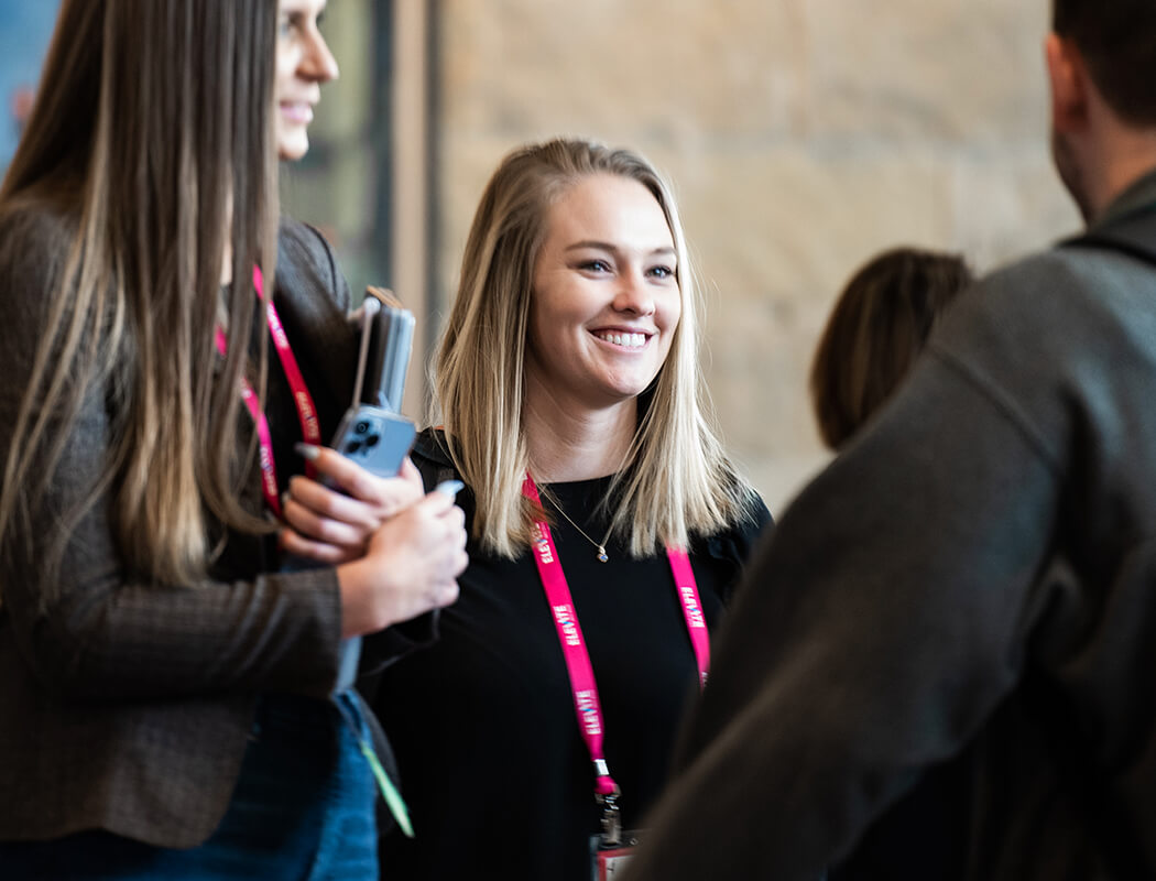 Insighters talking at an Elevate event